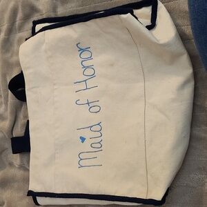 "Maid of Honor" tote with handwritten words in blue